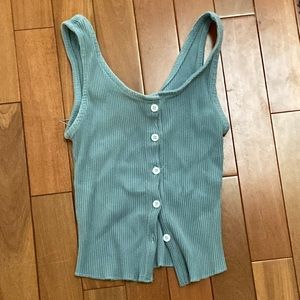 a tank top with buttons in front. I smile is the brandy and is blue